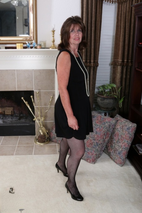 Slutty housewife gets naked and plays with a new sex toy