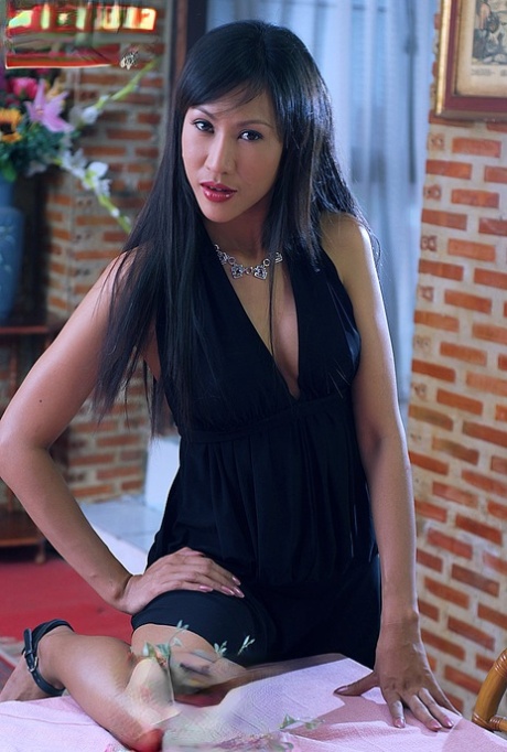 Beautiful Asian girl Nee Nalinda slips off a black dress to get naked in heels