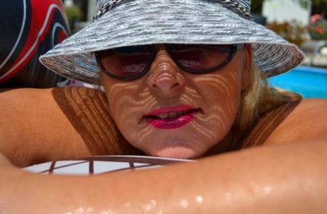 Sexy mature Chrissy models firm big tits & chubby nude body on and by the pool