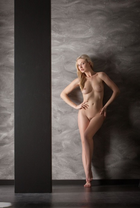 Tall blonde teen unleashes her nice tits before flaunting her perfect ass