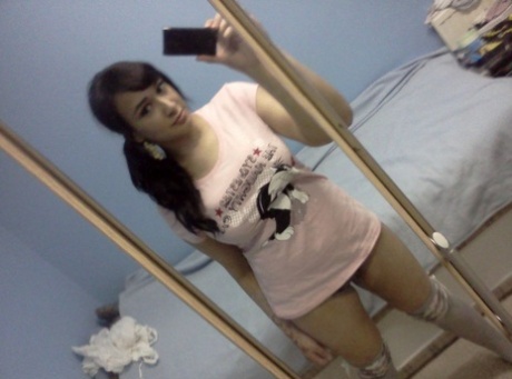 Indian BBW takes self shots in a mirror while showing her huge breasts