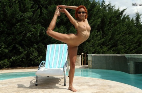 Slender redhead Veronica Leal takes a pee on a patio during a fist fuck