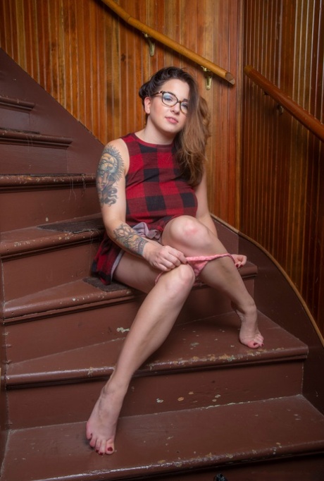 Chubby amateur Paige Rad touches her great tits after getting naked on stairs