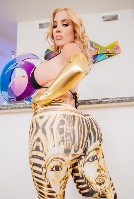 Blonde bombshell Savannah Bond gives a BJ on her knees in long gold gloves