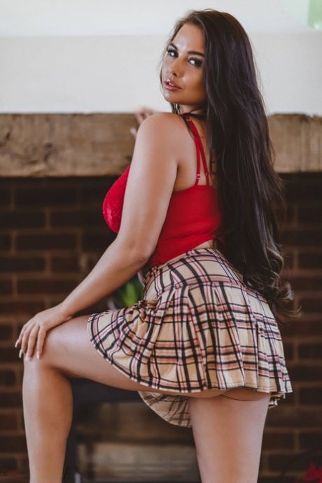Hot British girl Kym Graham crosses her legs before loosing her big boobs