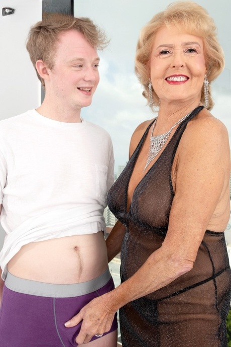 Blonde granny Desiree Eden has sexual intercourse with a young lad