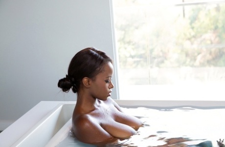 Ebony babe with perfect ass Jezabel Vessir poses in her bath