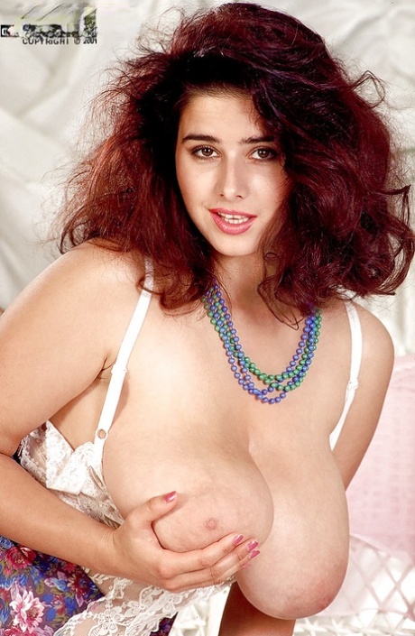 Redheaded French solo girl Chloe Vevrier flaunting huge juggs in stockings