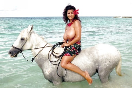 European solo model Chloe Vevrier demonstrating hooters in ocean and on beach