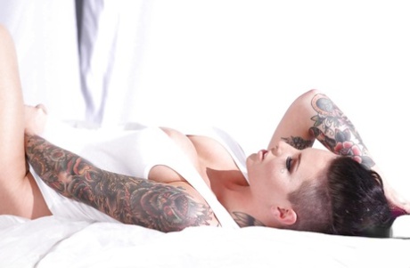 Tattooed knockout Christy Mack uncovering her flalwless curves