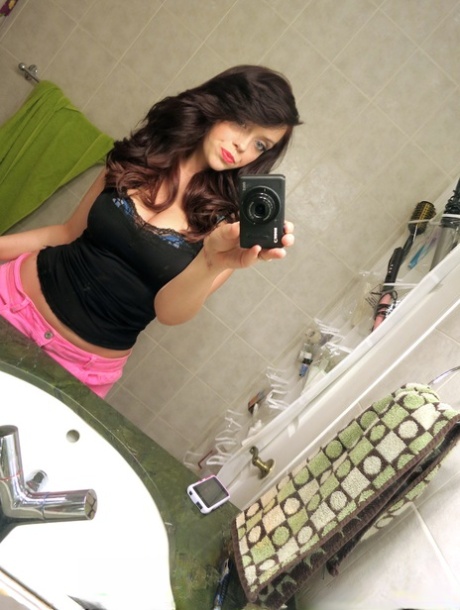 Alluring brunette teen takes selfies of natural big tits before POV titty fuck