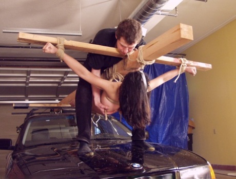 Bound big boobed Asian MILF Mika Tan gets strapped to the driving machine