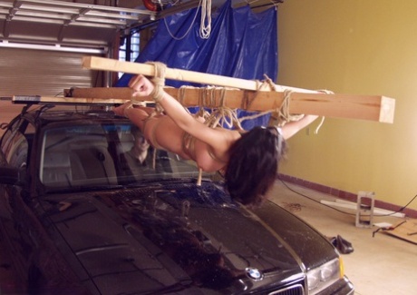 Bound big boobed Asian MILF Mika Tan gets strapped to the driving machine