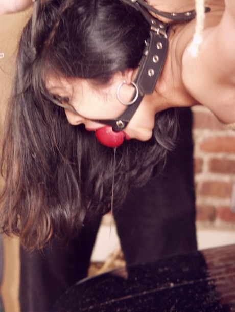 Bound big boobed Asian MILF Mika Tan gets strapped to the driving machine