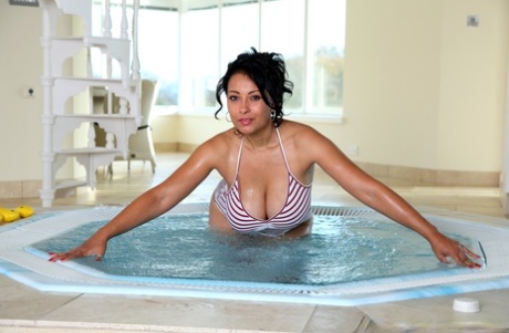 Curvaceous hairy MILF Danica Collins flaunting her large breasts by the pool