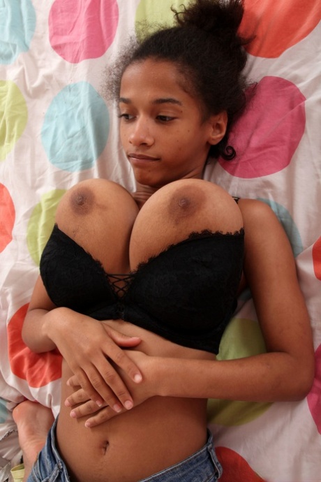 Young ebony Addisson unveils her tremendous breasts and flaunts them in a solo