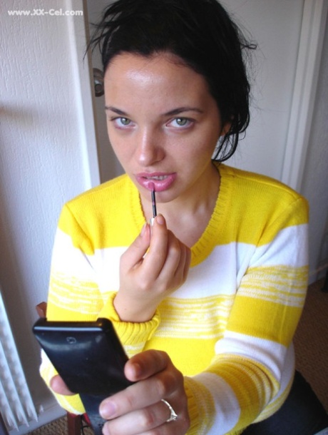 Amateur beauty Joana puts sexy lipstick on before revealing her natural tits