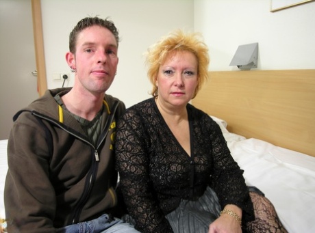 European cougar seduces a white stud and gets fondled & fucked on her bed