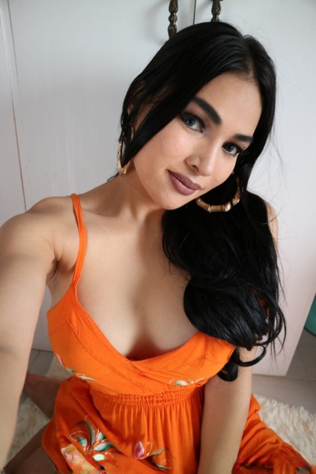 Gorgeous dark haired shemale Filipina flaunts her beautiful boobs