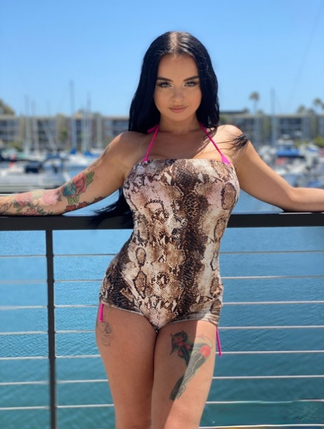 Curvaceous stunner Payton Preslee flaunting her huge melons in a pink bikini