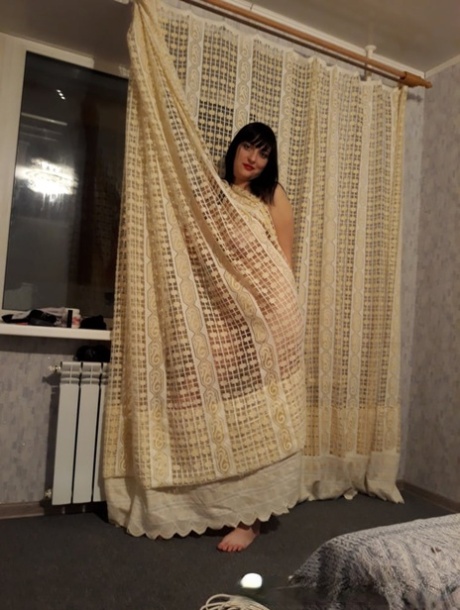 Sensational MILF amateur reveals her huge juggs and poses naked on a sofa bed