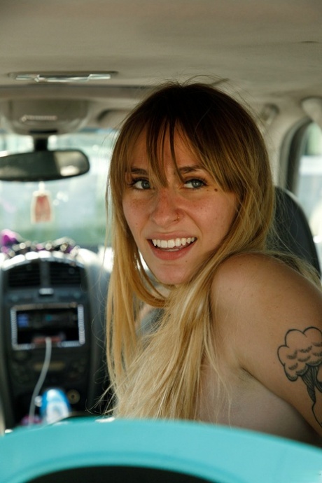 Naughty blonde Angel Youngs shows off her juicy tits topless in a taxi cab