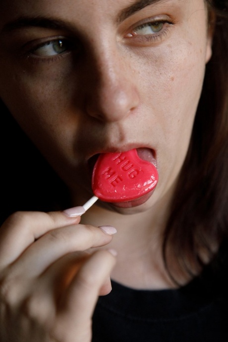 Amateur Milly Marks flaunts her incredible big tits while licking a lollipop