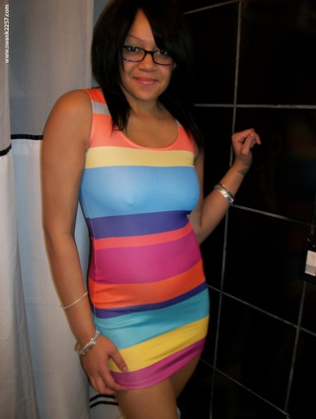 Sweet amateur girl in glasses Krista T unveils her big suckable tits and poses