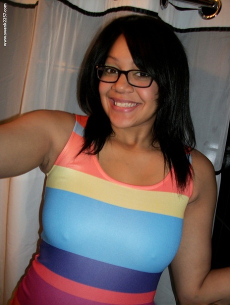 Sweet amateur girl in glasses Krista T unveils her big suckable tits and poses