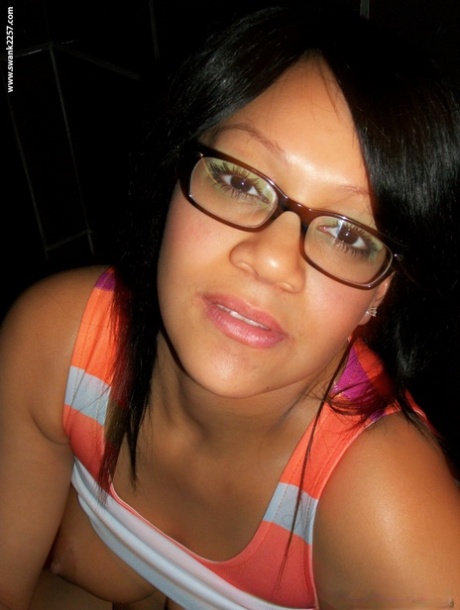 Sweet amateur girl in glasses Krista T unveils her big suckable tits and poses
