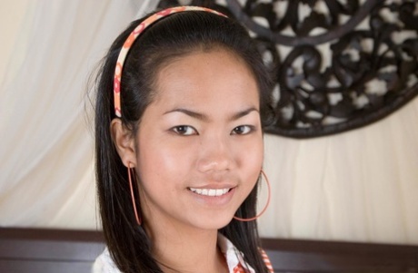 Gorgeous Thai teen Bim strips in a solo and exposes her big juicy tits