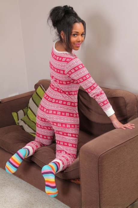 Busty ebony babe Rehea strips off her pajamas and poses in her panties & socks