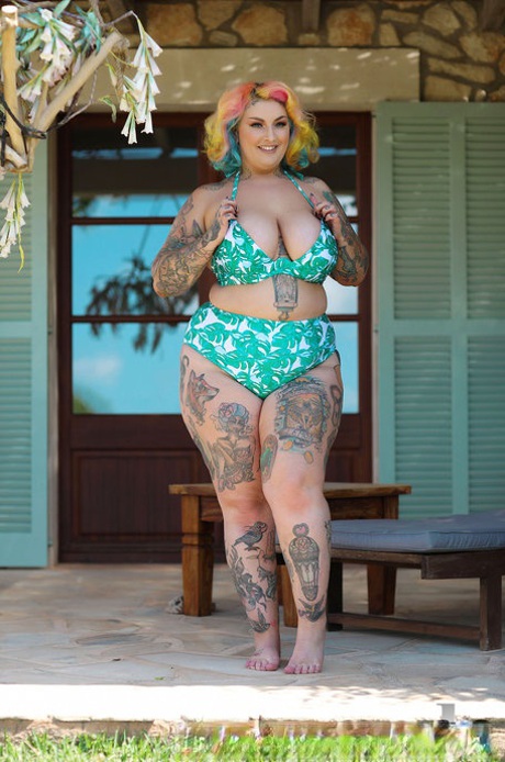 Inked BBW with rainbow hair Galda Lou exposes her huge melons and big butt