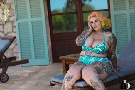 Inked BBW with rainbow hair Galda Lou exposes her huge melons and big butt