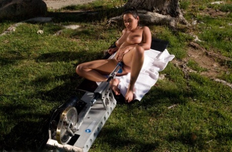 Busty Latina Charley Chase getting fucked by a machine dildo outdoors
