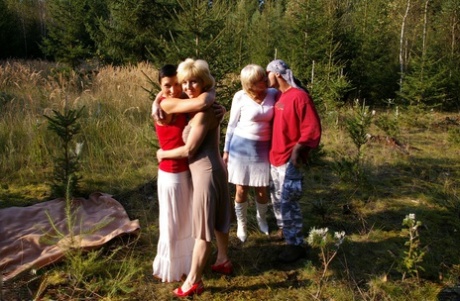 Fat amateur grannies share a dick after stripping in nature on a sunny day