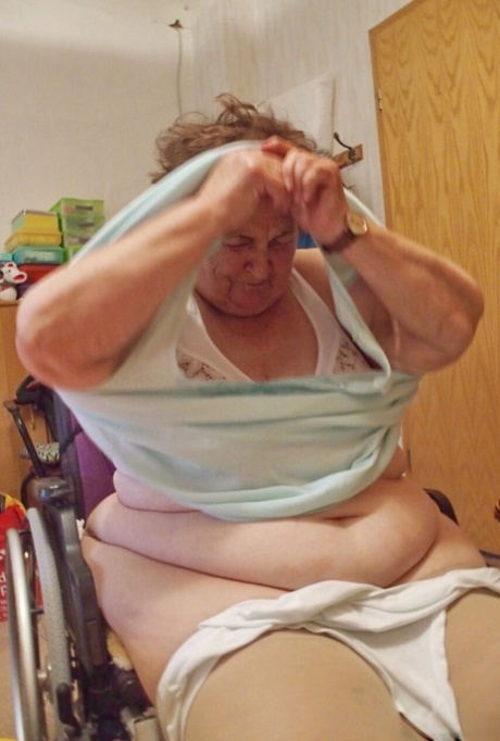 Chubby granny Aloysia plays with her saggy tits while undressing