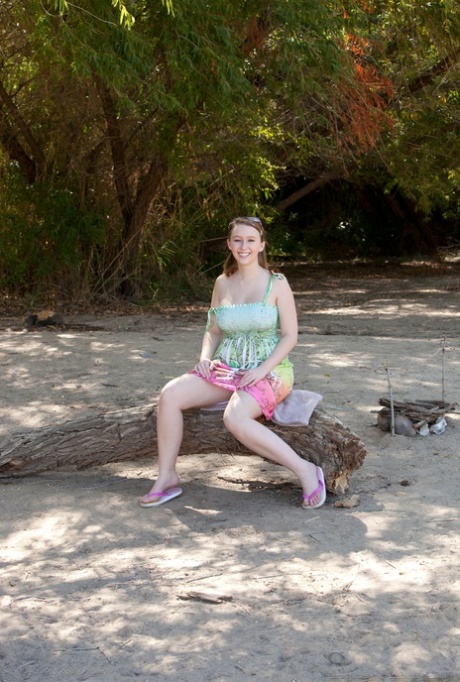 Amateur girl in sunglasses Felicia exposes her massive tits outdoors