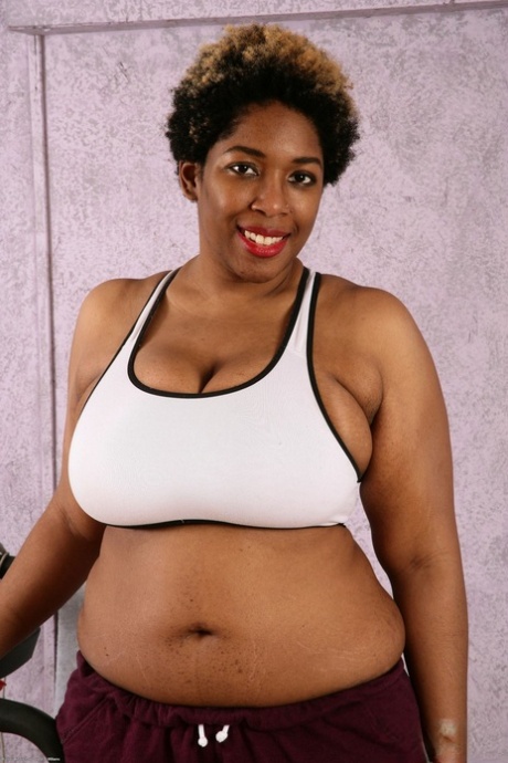 Chubby ebony Misty lets out her huge melons and flaunts her hairy twat